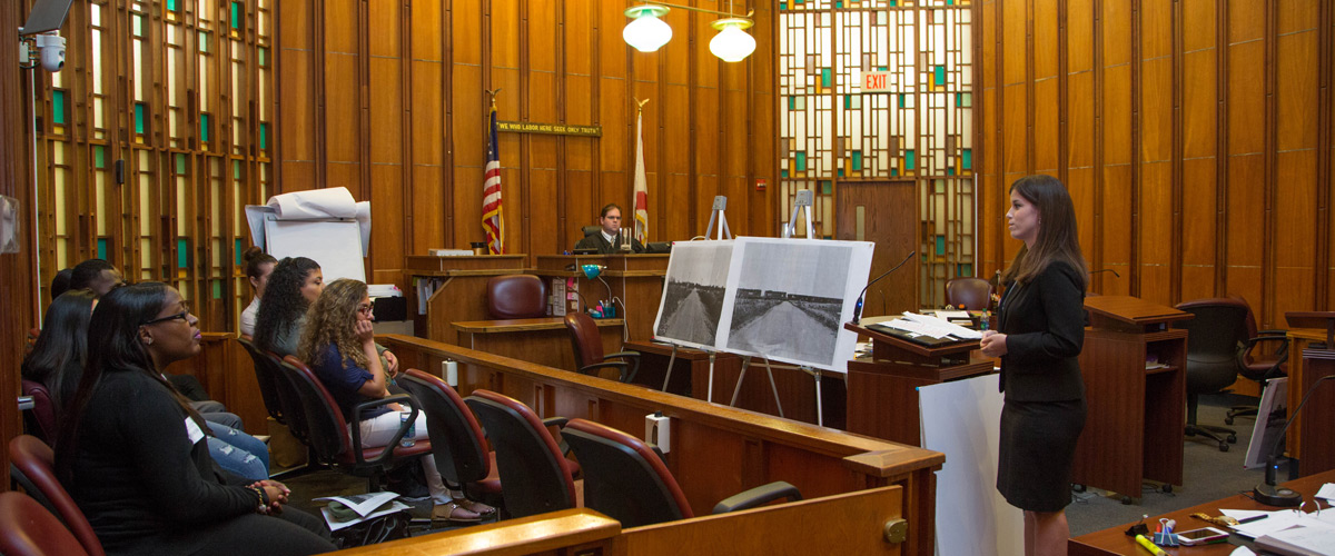 Student practicing in a court room